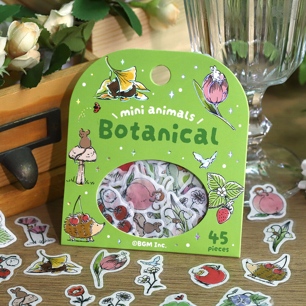 Packaging of Botanical mini animals stickers with illustrations on a wooden surface.
