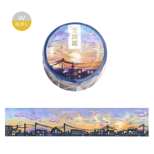 Washi tape with artistic design of a bridge and sunset, on a white background.