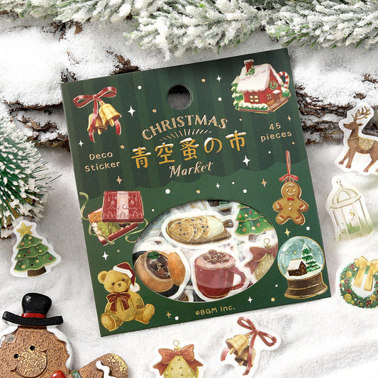 Pack of Christmas-themed stickers with illustrations on a snowy background