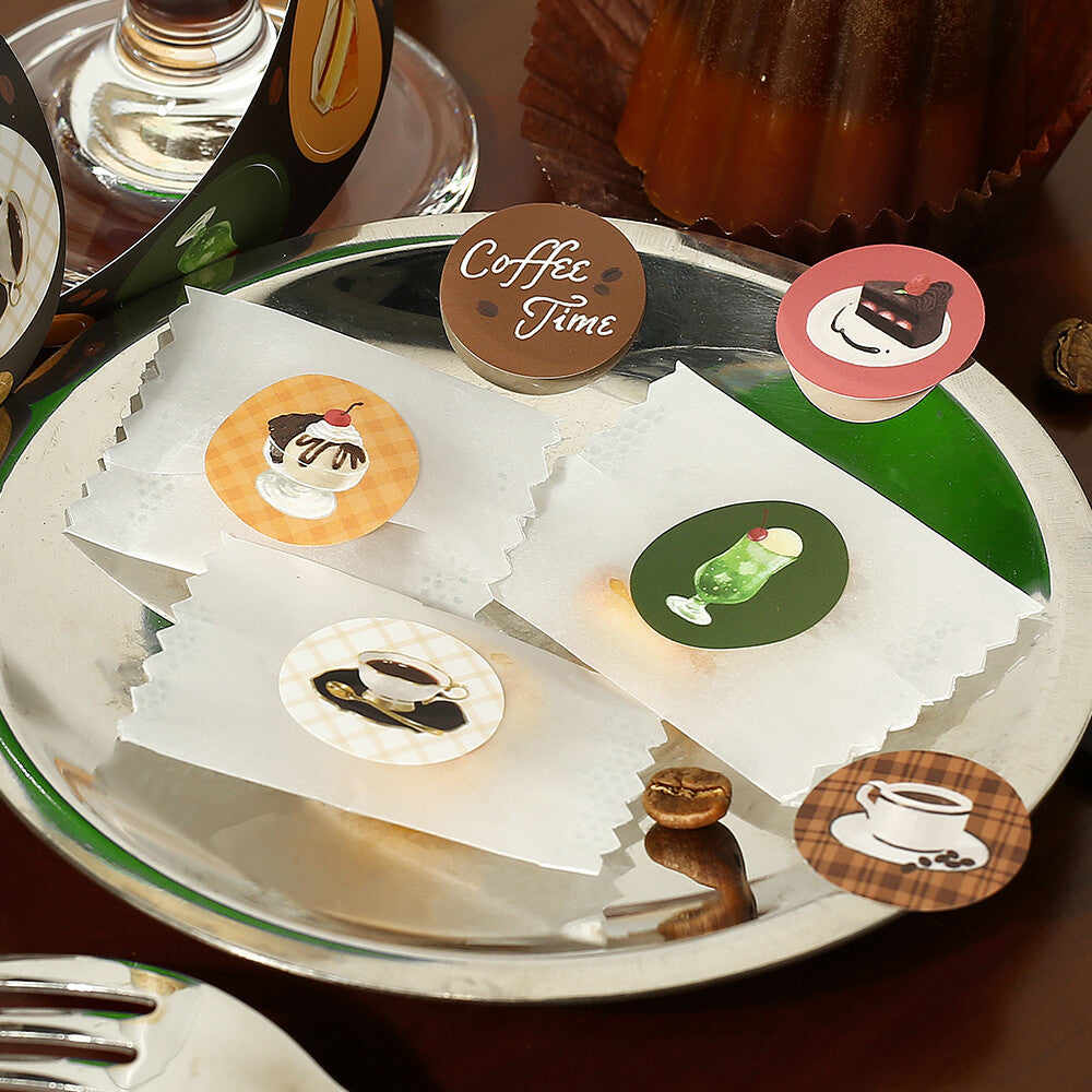 Decorative coasters with coffee-themed designs on a tray.