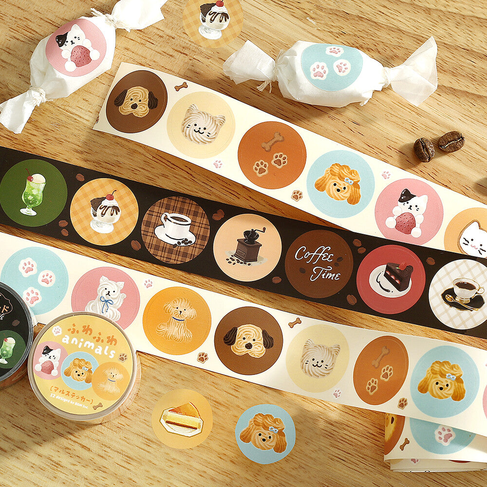 Set of decorative paper strips with animal-themed designs on a wooden surface.