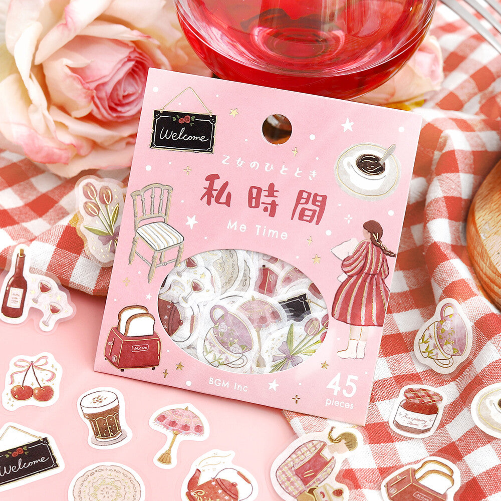 Pack of decorative stickers with illustrations on a checkered tablecloth with roses and a glass of red wine.