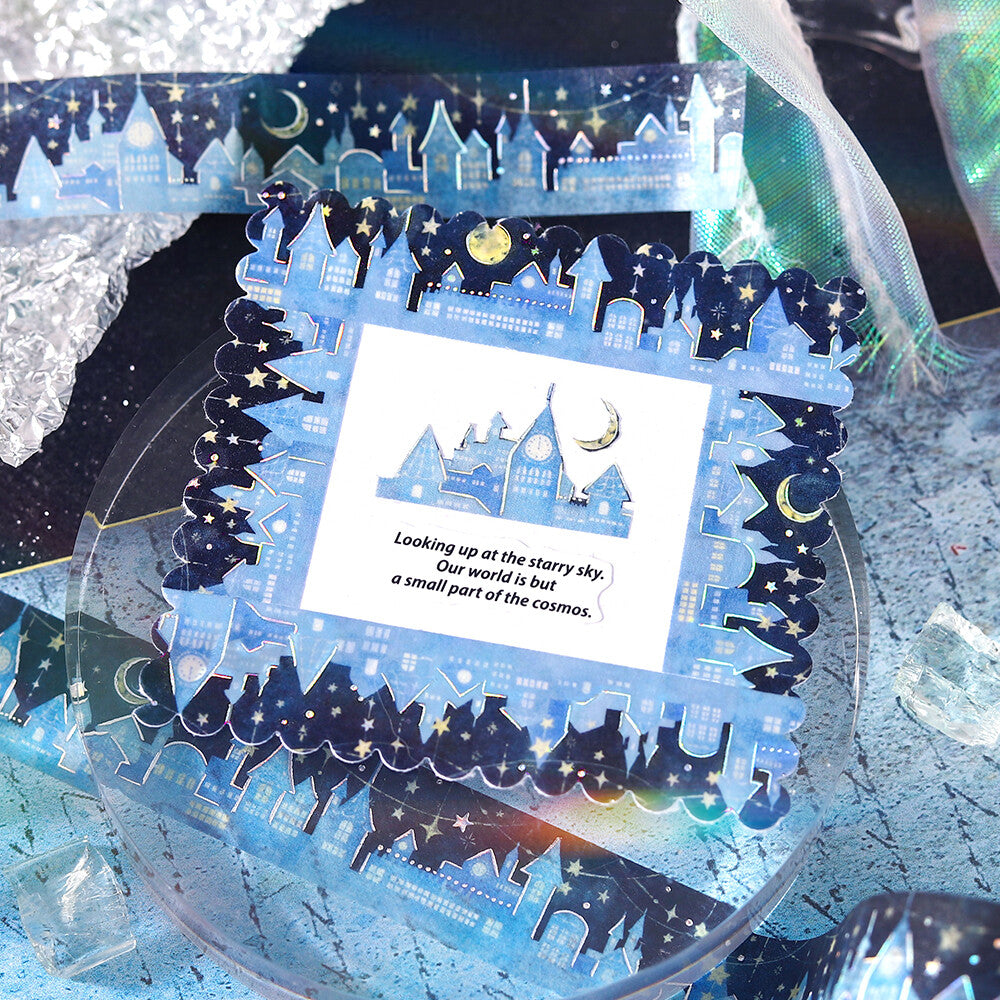 Decorative glass panel with a night sky design, houses, and a moon.