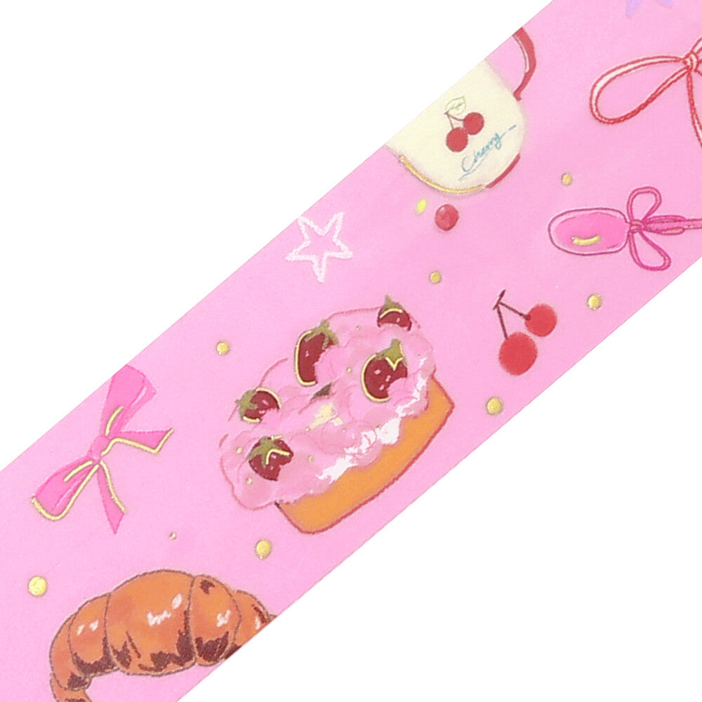Decorative paper roll with cake, cherry, and bow designs on a pink background