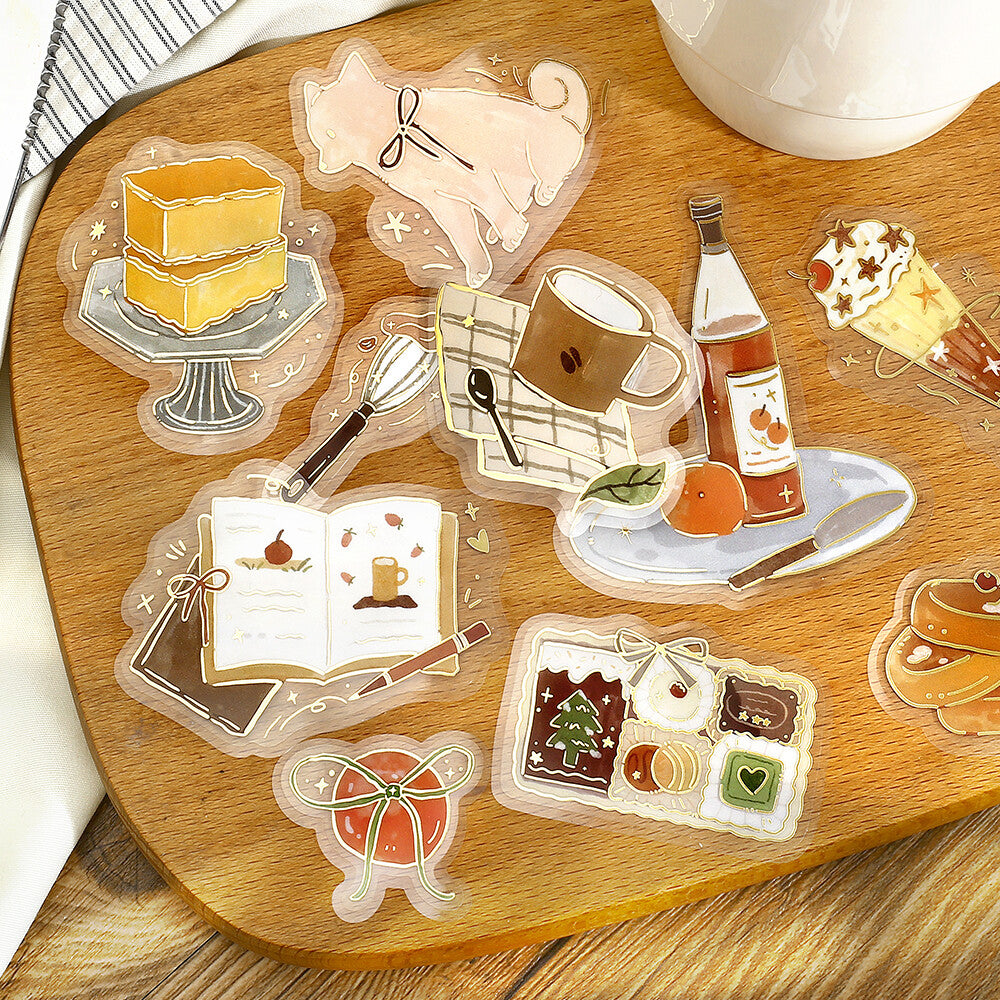 Transparent stickers with food and drink illustrations on a wooden surface