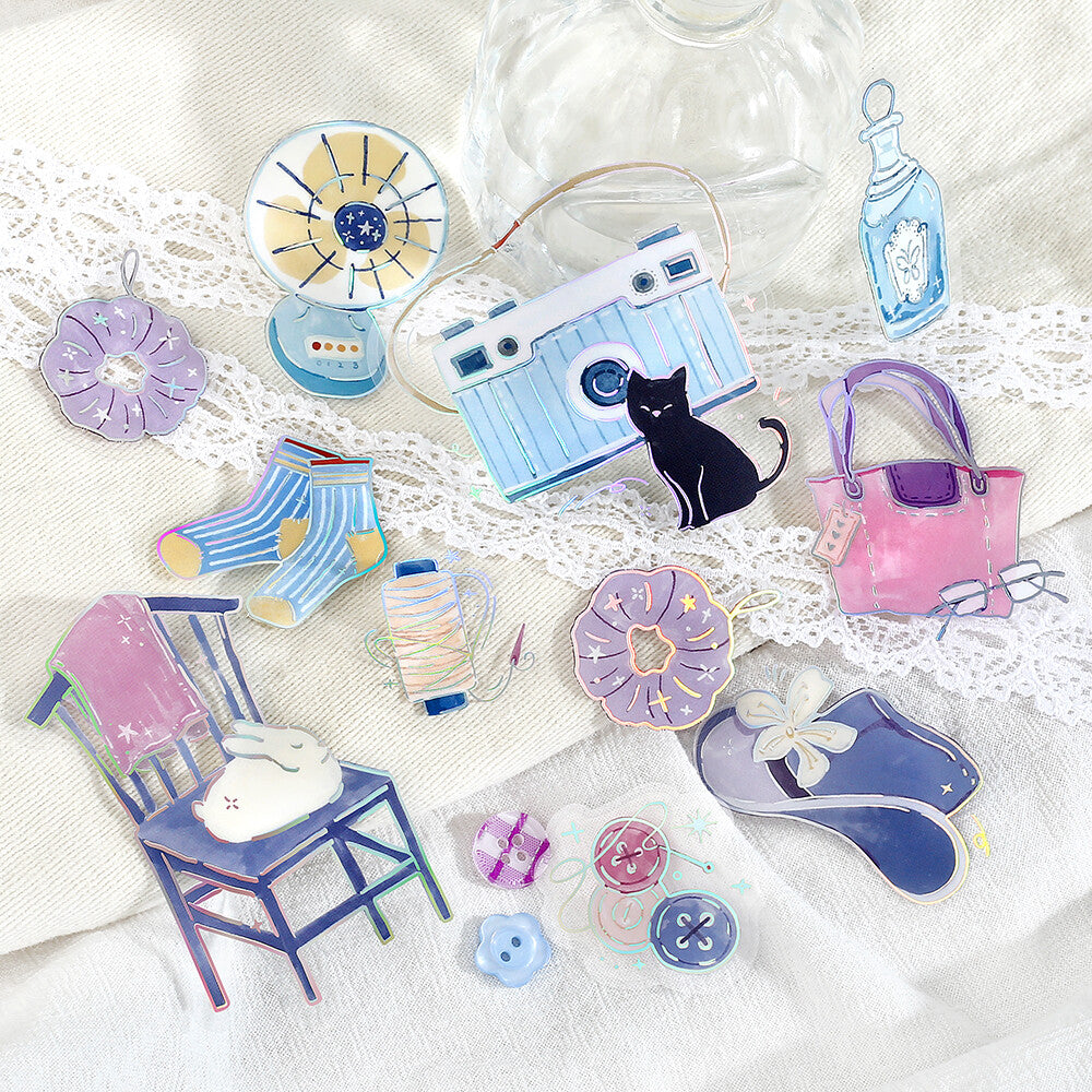 Collection of colorful enamel pins on a textured white background