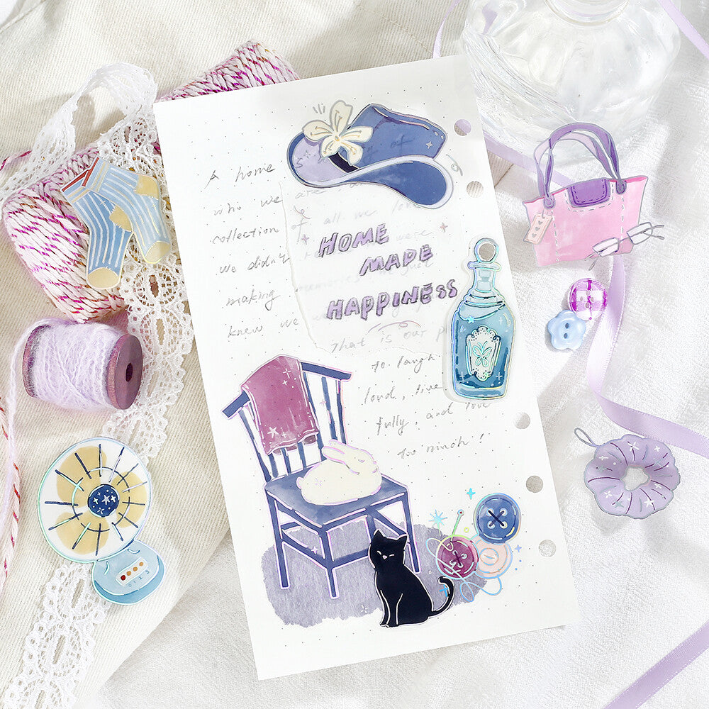 Decorative paper with illustrations of a chair, cat, and various objects on a white background.