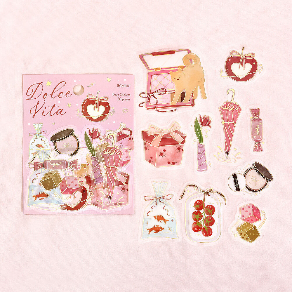 Sticker set with 'Dolce Vita' packaging on a pink background