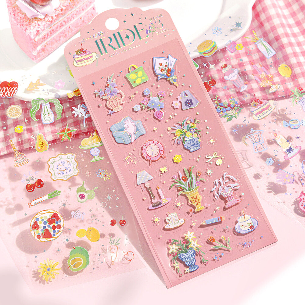 Pink sticker book with various cute illustrations on a checkered fabric background