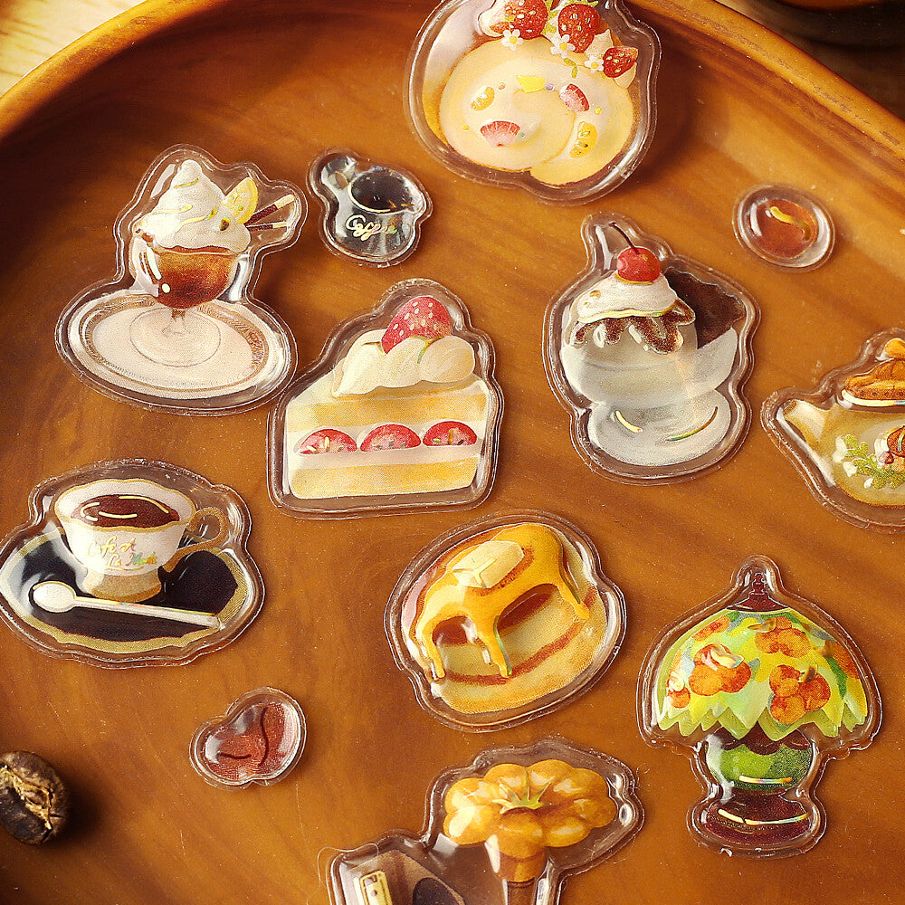 Collection of dessert-themed clear stickers on a wooden surface