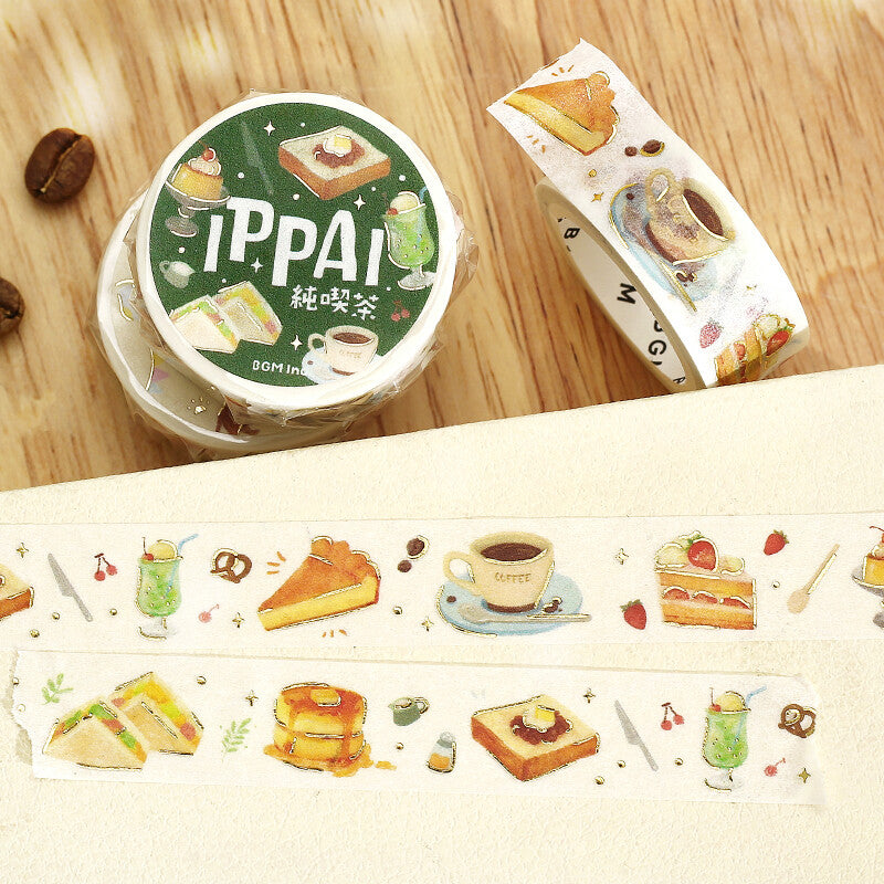 Washi tape with decorative tape featuring food illustrations on a wooden surface.