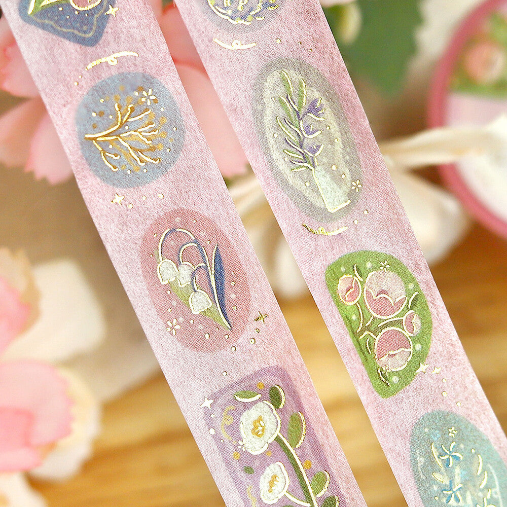 Decorative tape with floral designs on a pink background