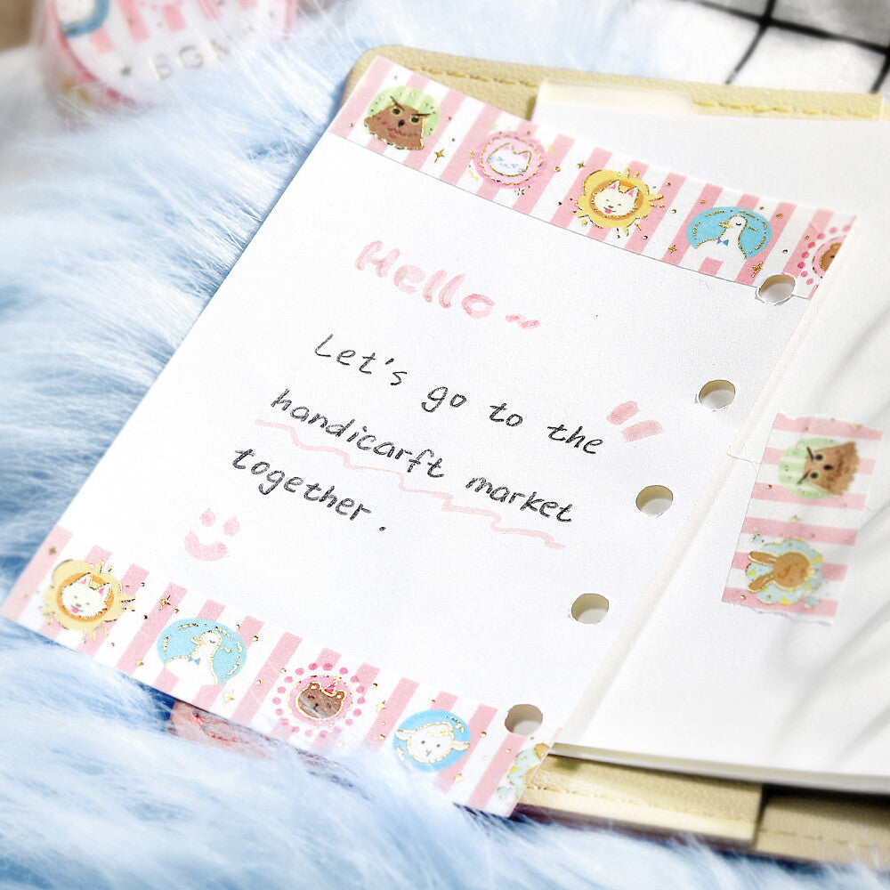 Notebook with decorative stickers and text on a blue textured surface