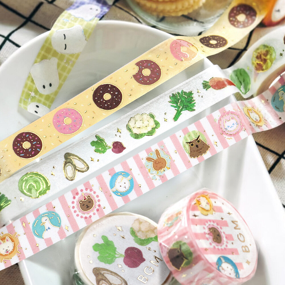 Set of colorful washi tape rolls with various designs on a white surface.