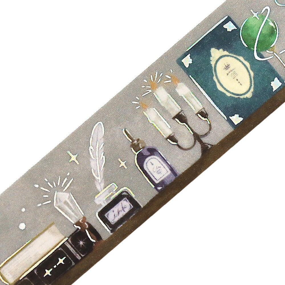 Decorative washi tape with illustrations of bottles, candles, and feathers on a gray background