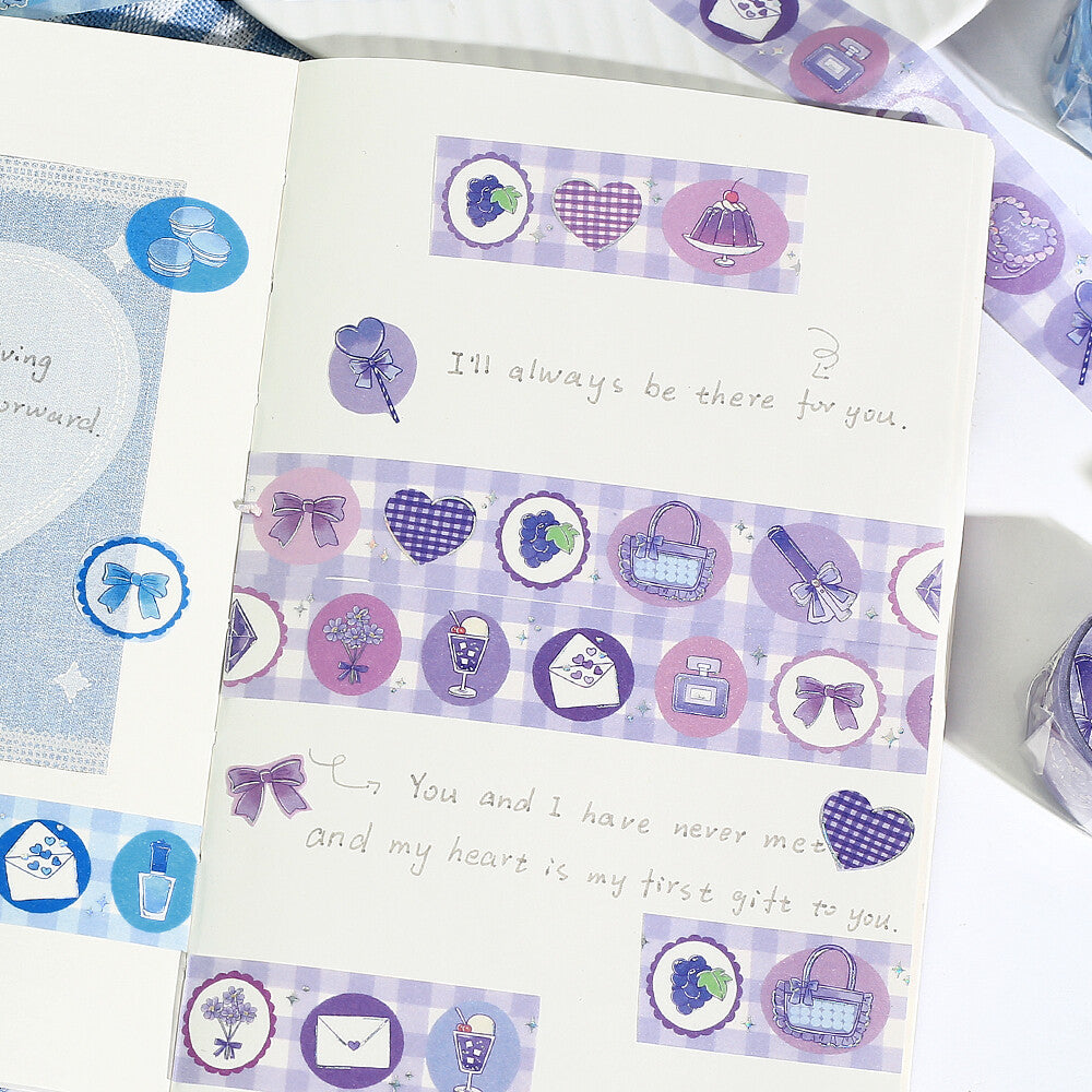 Decorative stationery set with purple and white designs on a white background