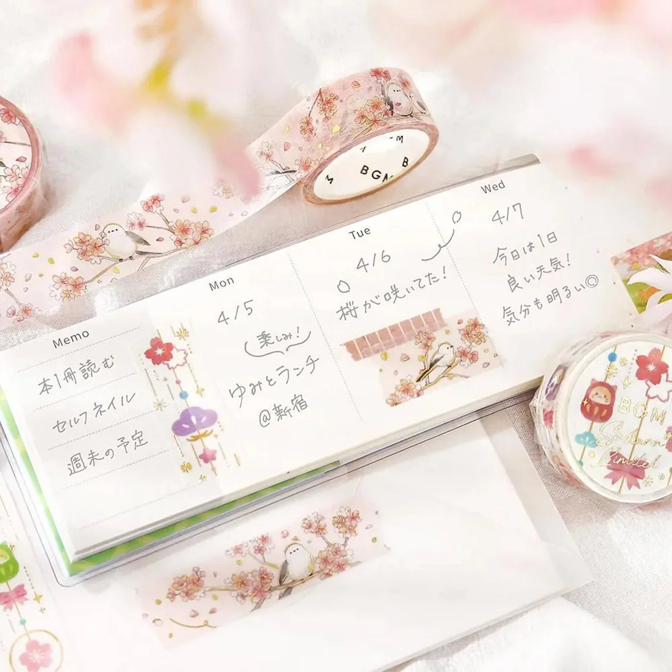 Floral washi tape with a planner and stationery items on a light background