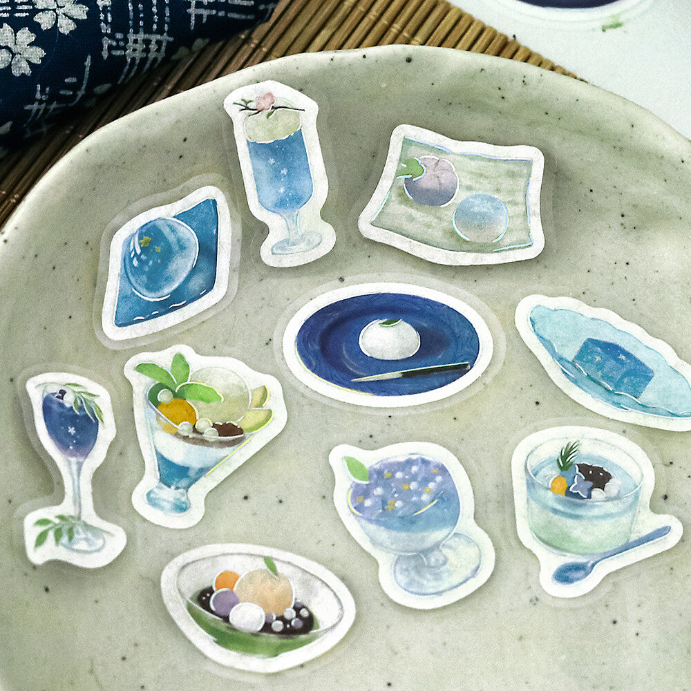 Set of food-themed stickers on a textured surface