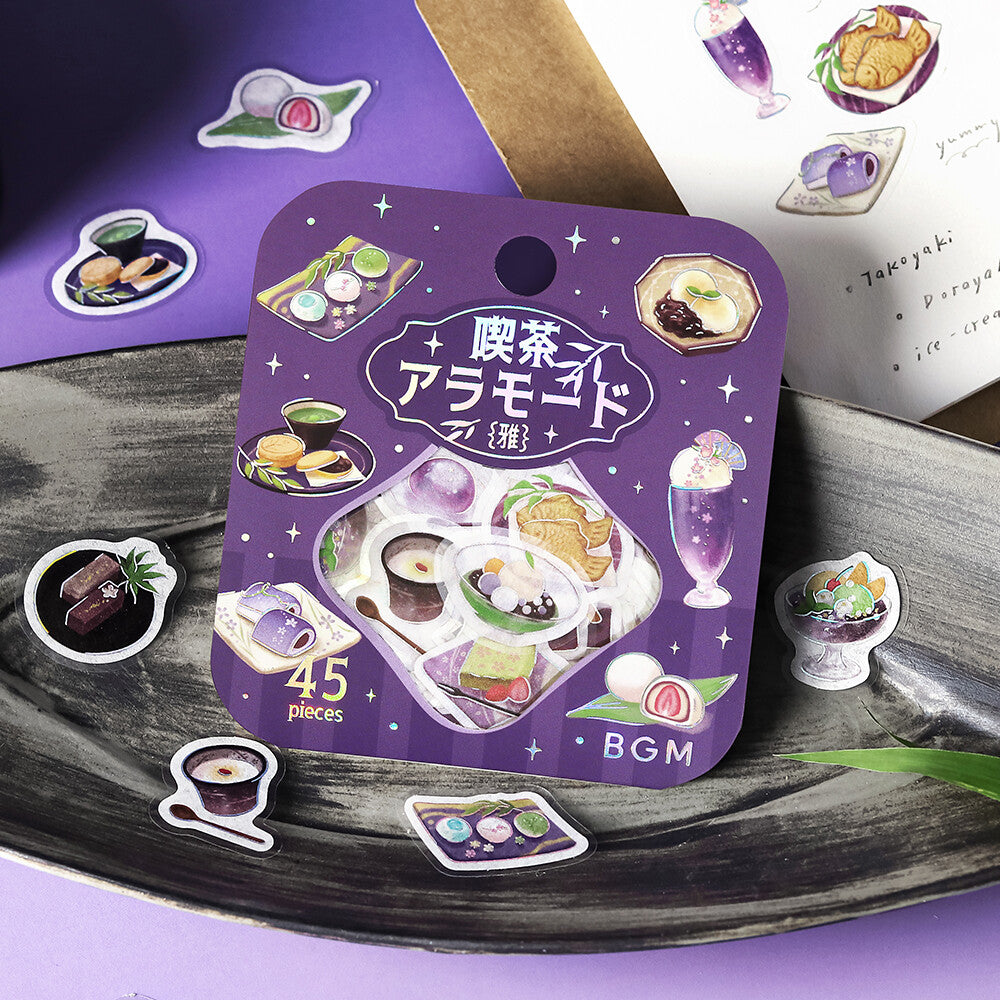 Packet of dessert illustration stickers by BGM with theme purple colours on textured surface