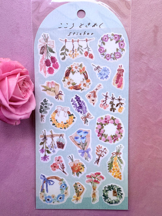 Sticker sheet with floral designs on a pink background