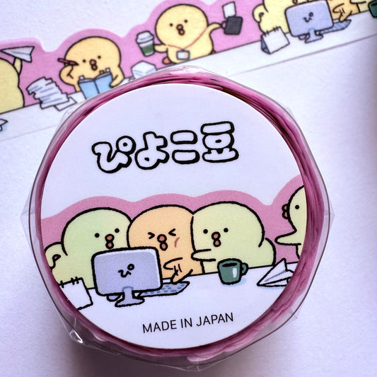 Roll of washi tape with cartoon characters and text on a white background