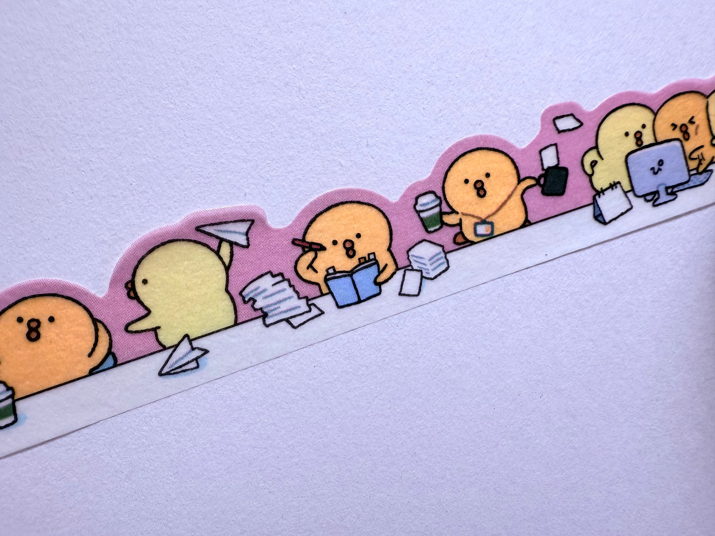 Decorative border with cartoon characters on a light purple background