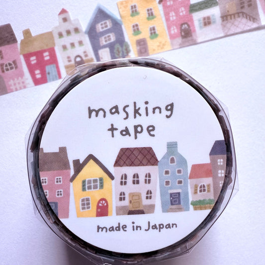 Roll of masking tape with house design and 'made in Japan' text on a white background