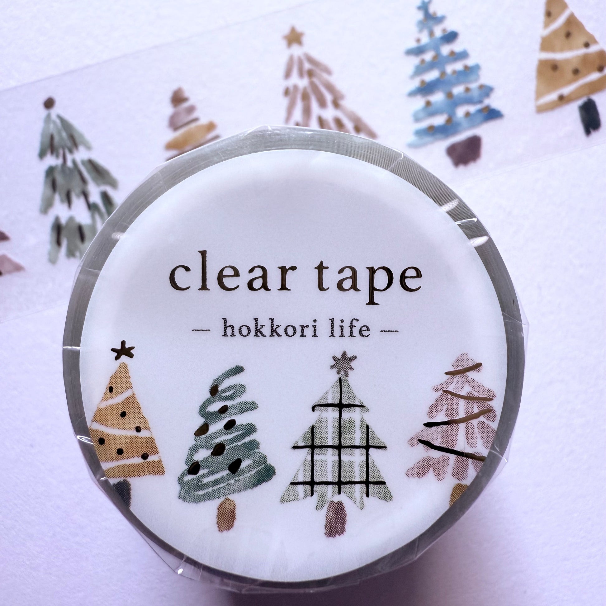 Clear tape with decorative labels on a white background