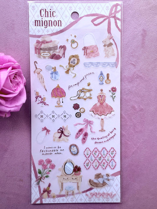 Sheet of decorative stickers with illustrations and text on a pink background