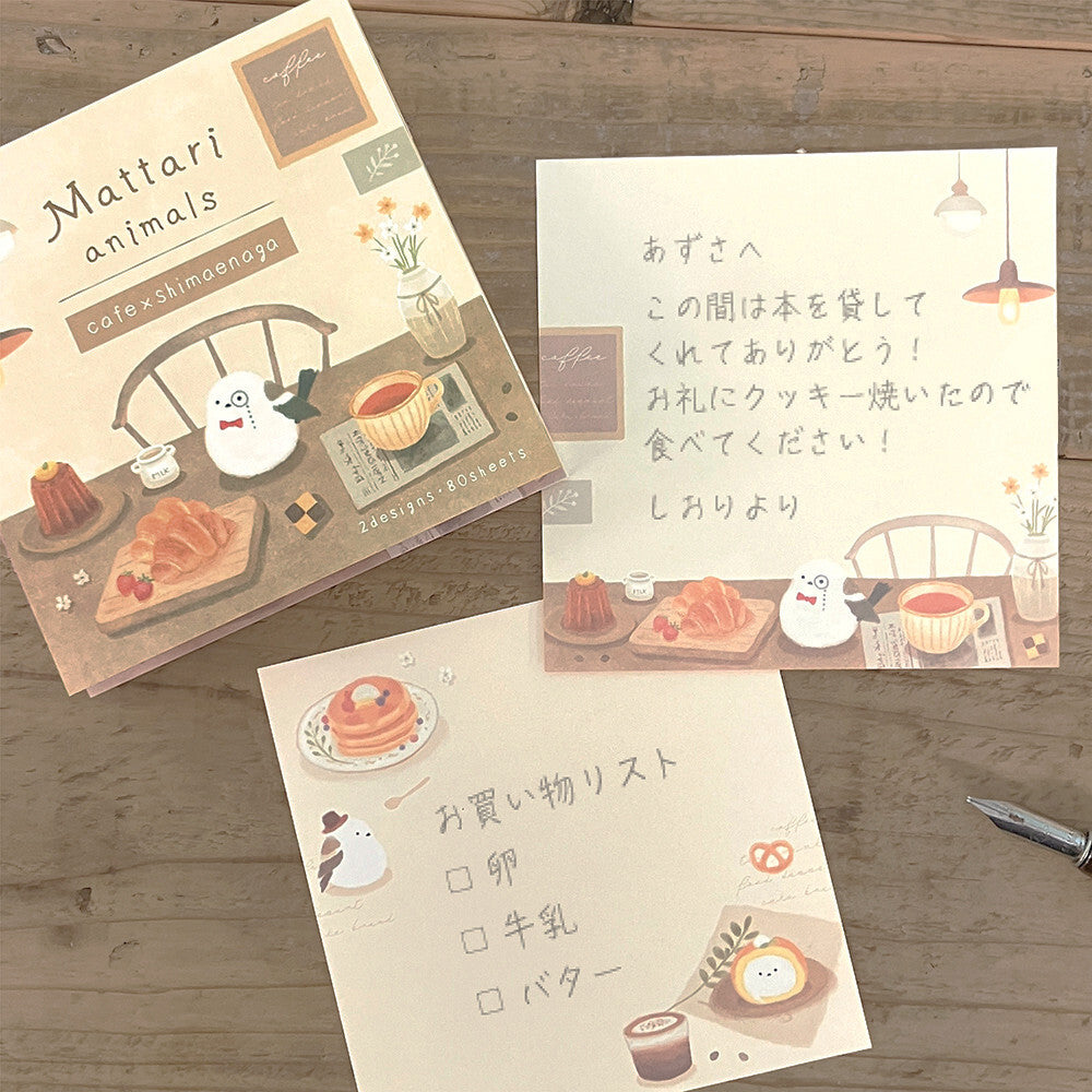 Set of stationery items with cartoon characters and text on a wooden surface