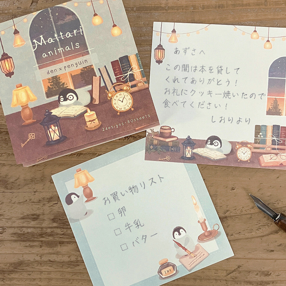Three illustrated stationery items on a wooden surface