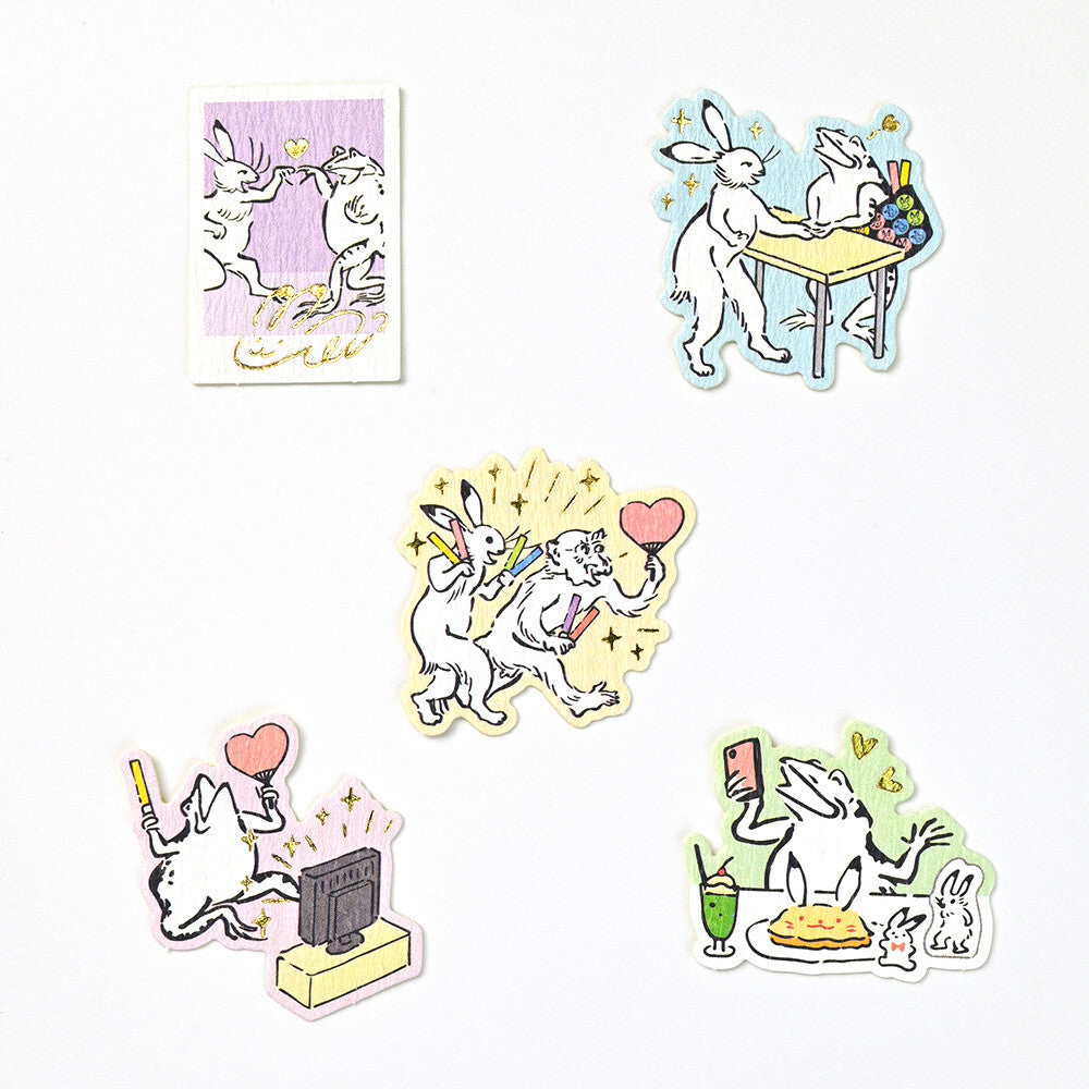 Set of cartoon rabbit stickers on a white background