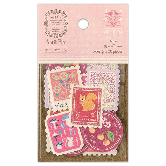 Packaged stickers with decorative designs on a pink background