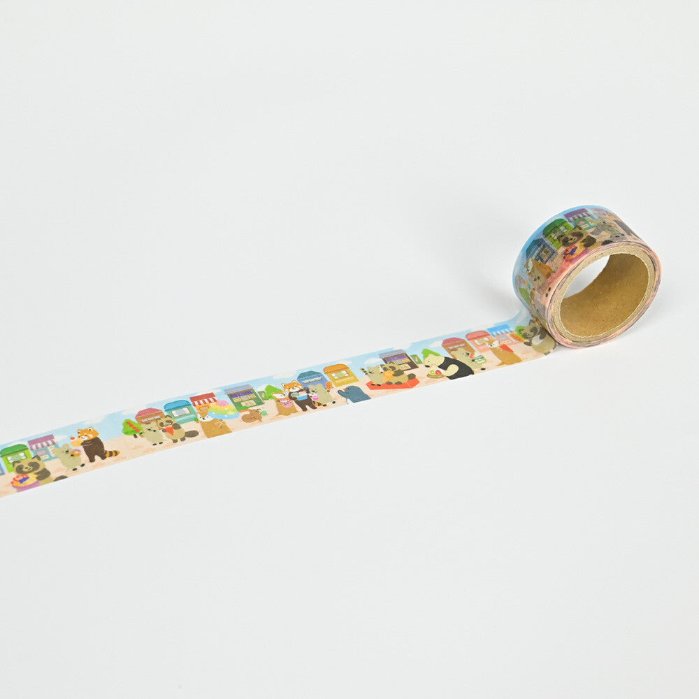 Roll of decorative tape with colorful designs on a white background