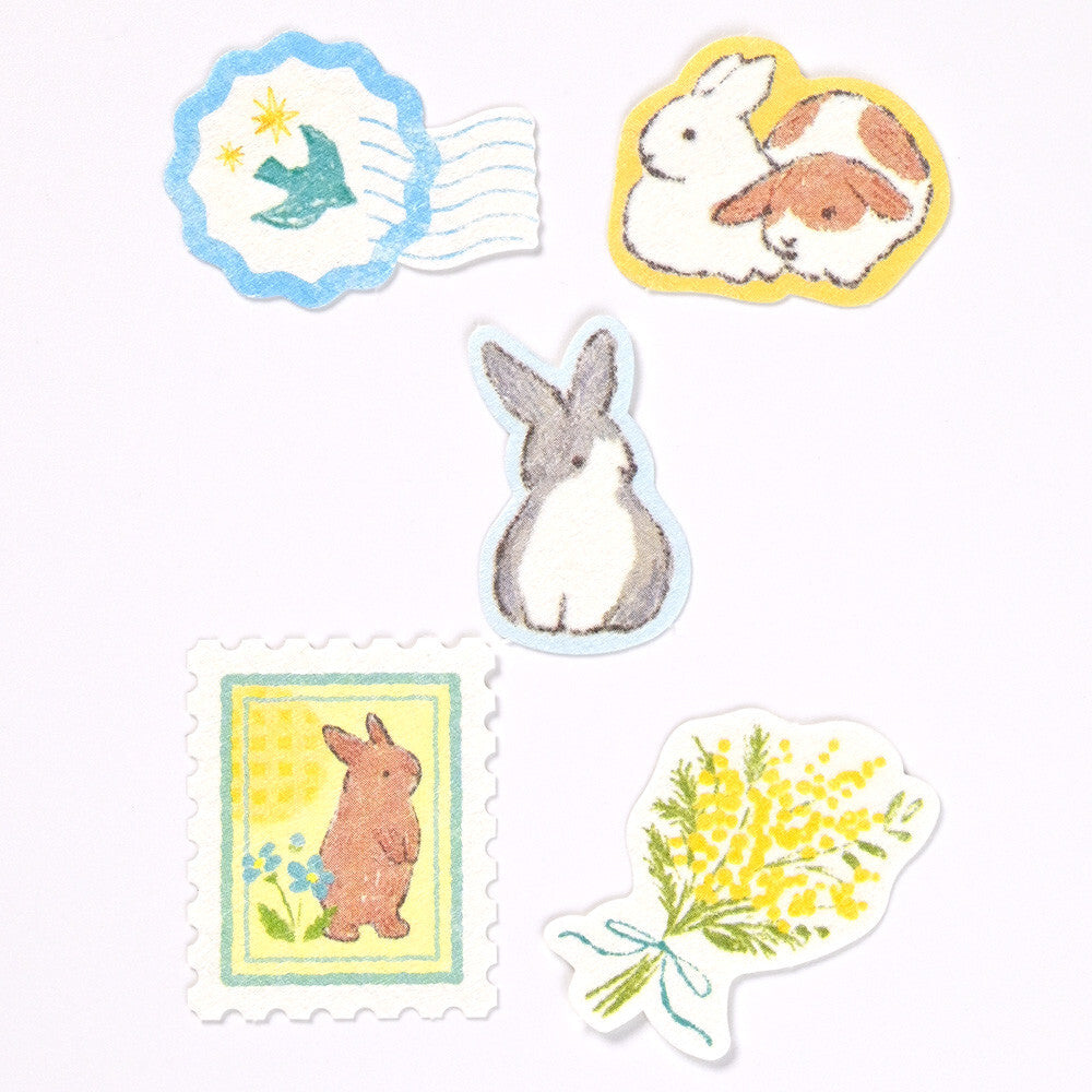 Set of decorative stickers featuring rabbits and floral designs on a white background