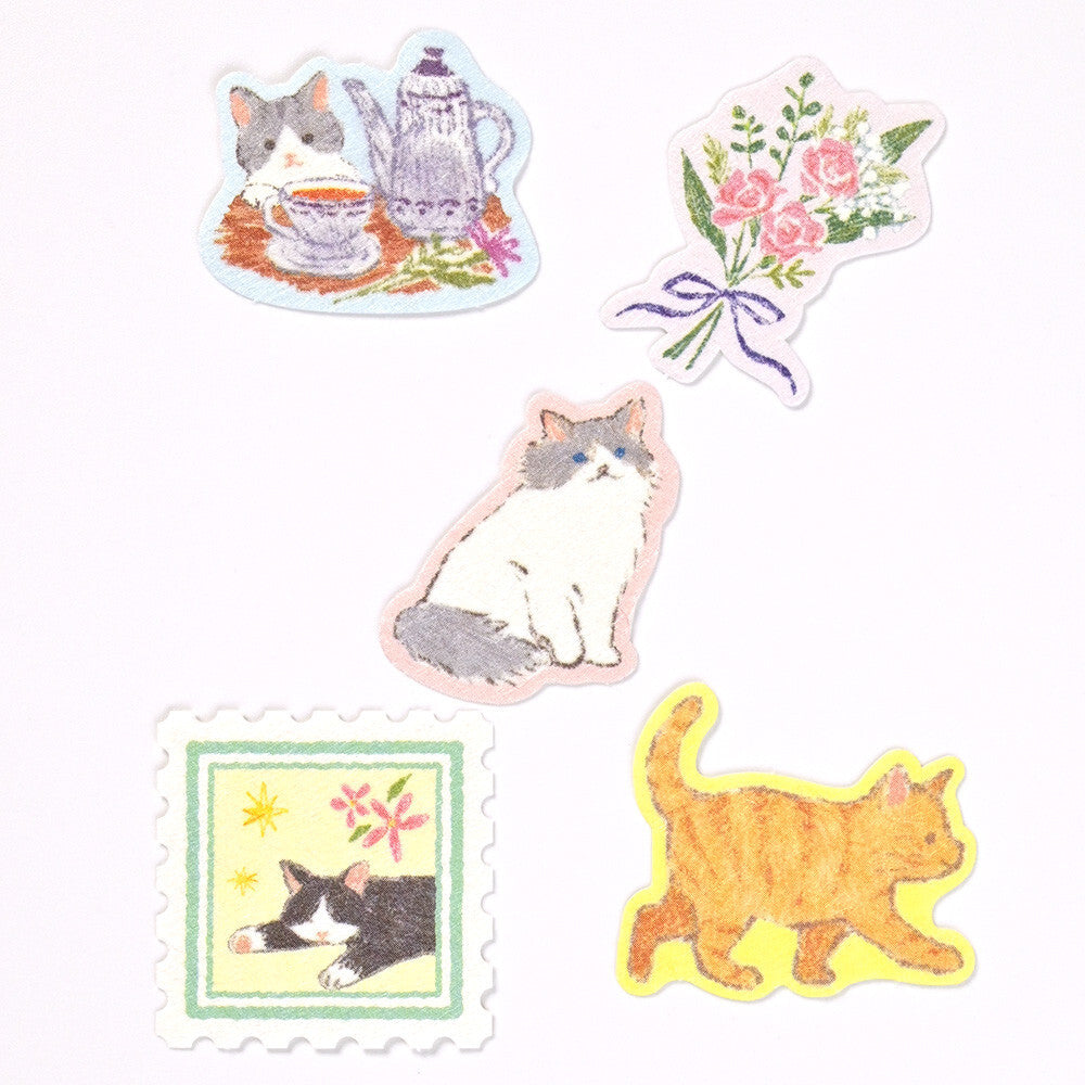 Set of cat-themed stickers on a white background