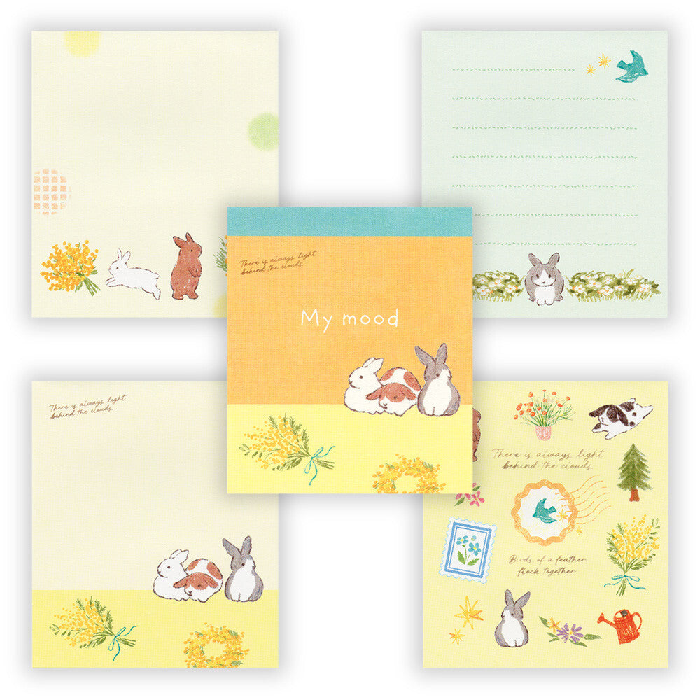 Set of stationery items with cute animal illustrations on a white background