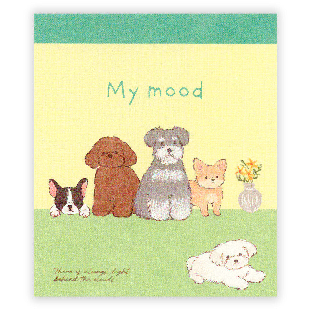 Notebook cover with illustrations of dogs and a small plant on a yellow and green background.