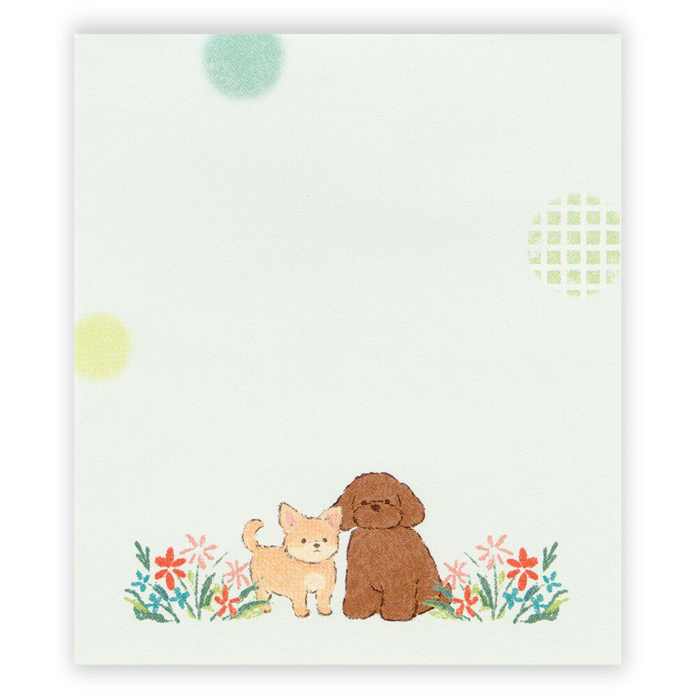 Notepad with illustrations of a dog and a cat on a white background with colorful polka dots and flowers.