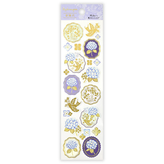 Sheet of decorative stickers with floral and nature-themed designs on a white background.