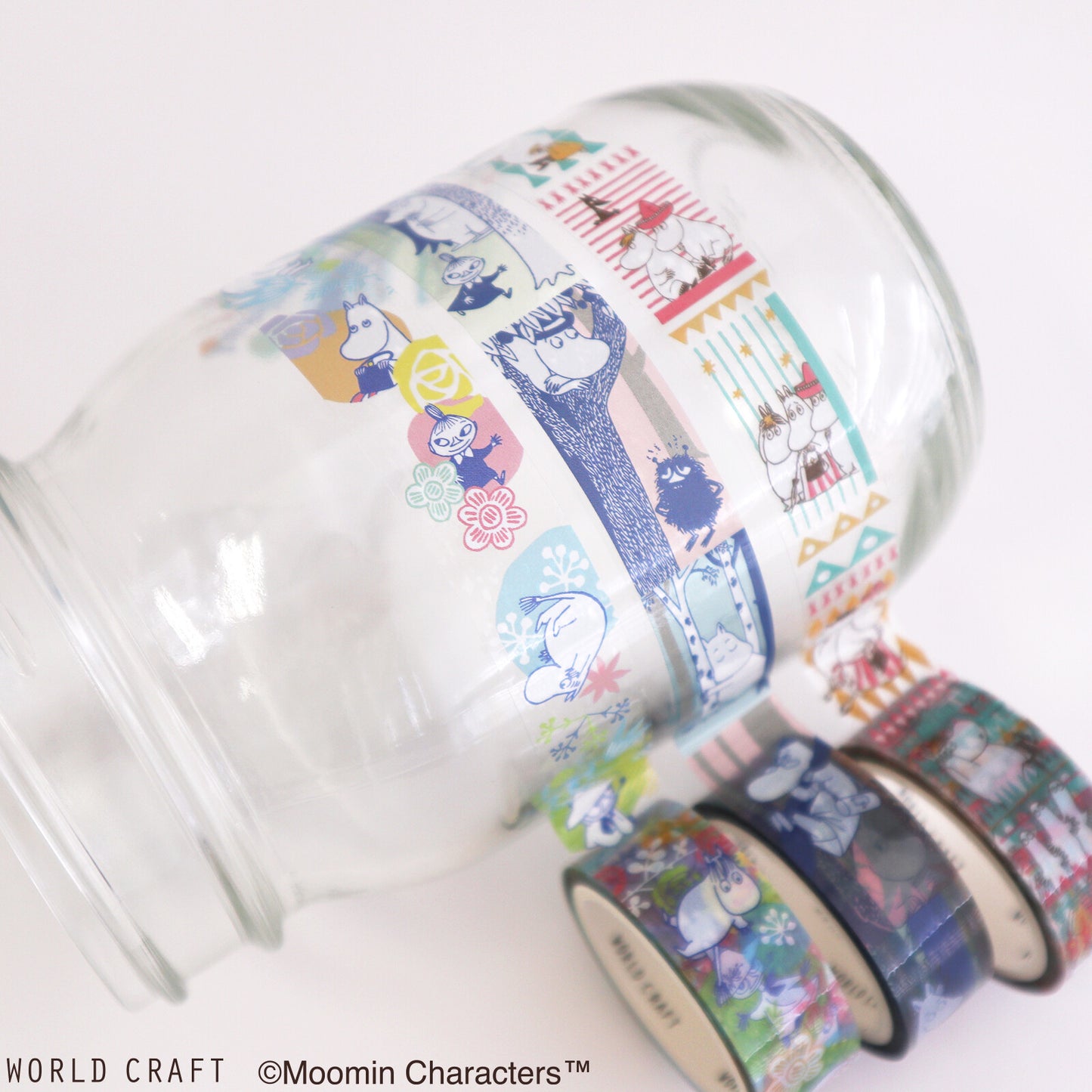 Set of colorful washi tape rolls with Moomin characters on a white background