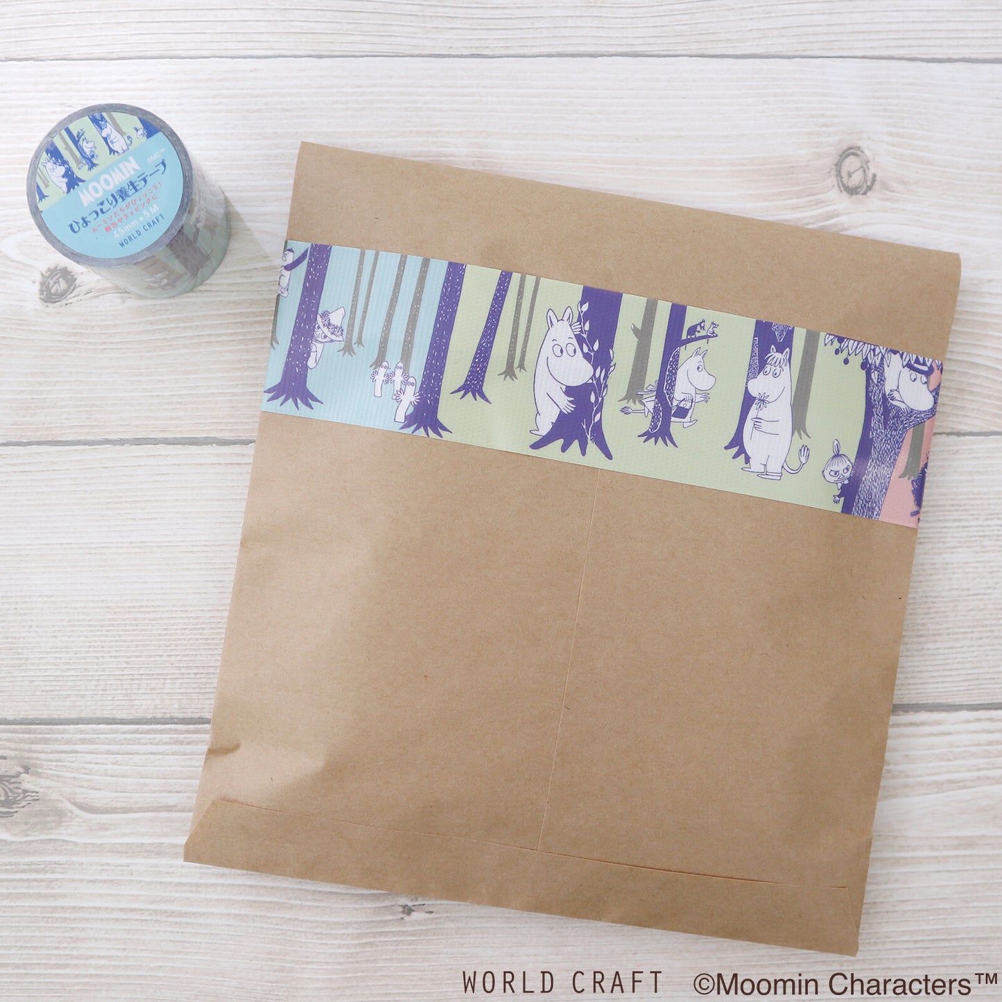 Brown paper bag with Moomin character design on a wooden surface
