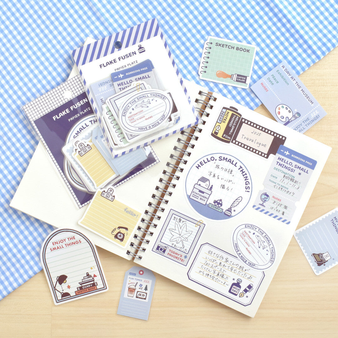 Papier Platz sticker flake packet of stickers on blue plaid background