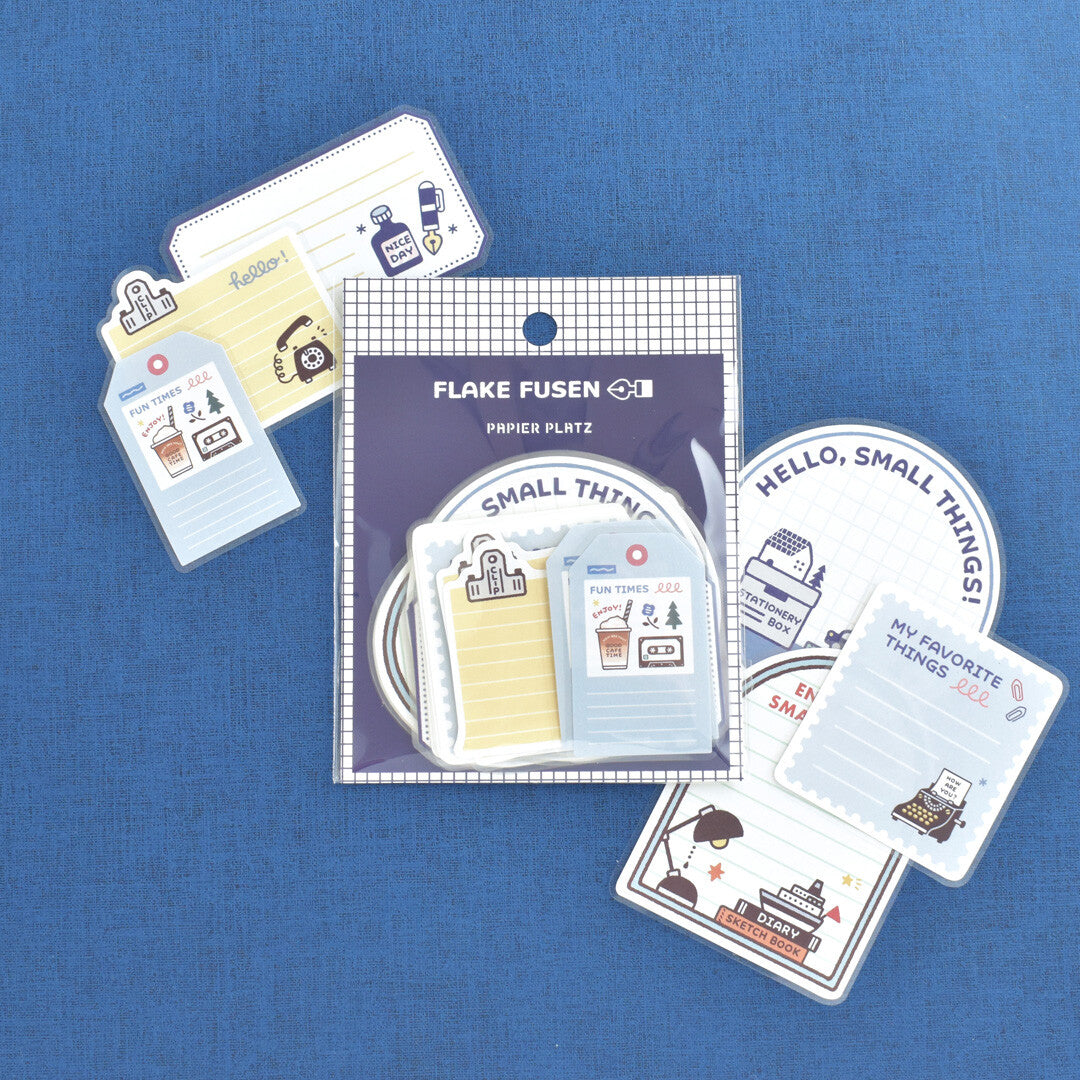 Papier Platz sticker flake packet of stickers on blue background