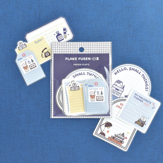 Papier Platz sticker flake packet of stickers on blue background