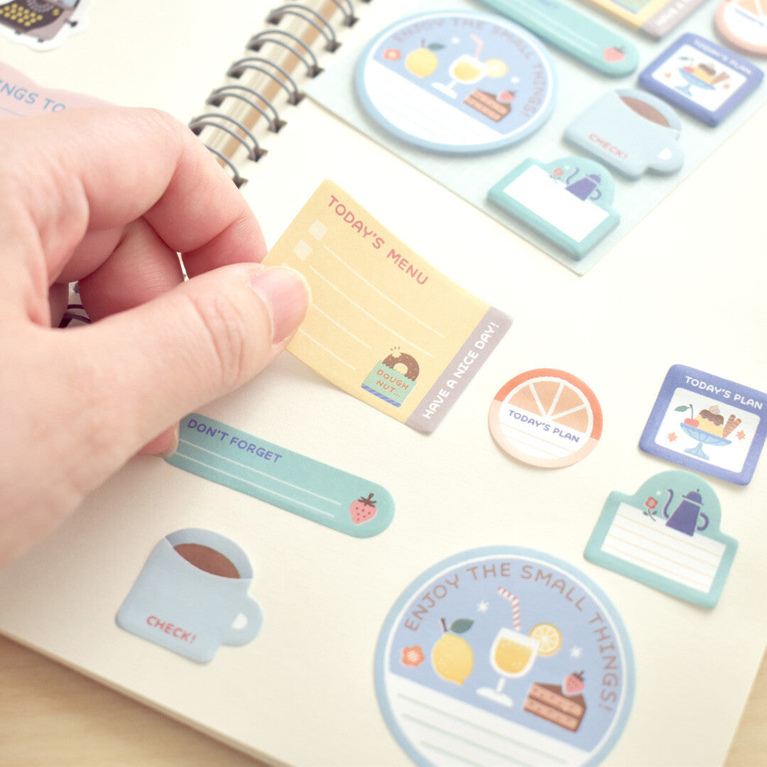 A hand using sticky notes 