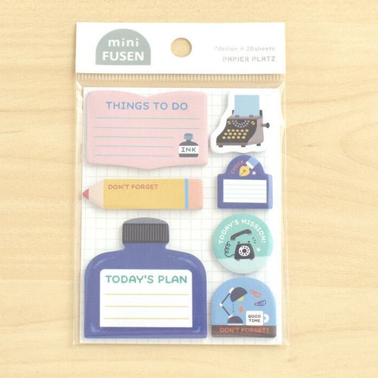 Packet of sticky notes on wooden background