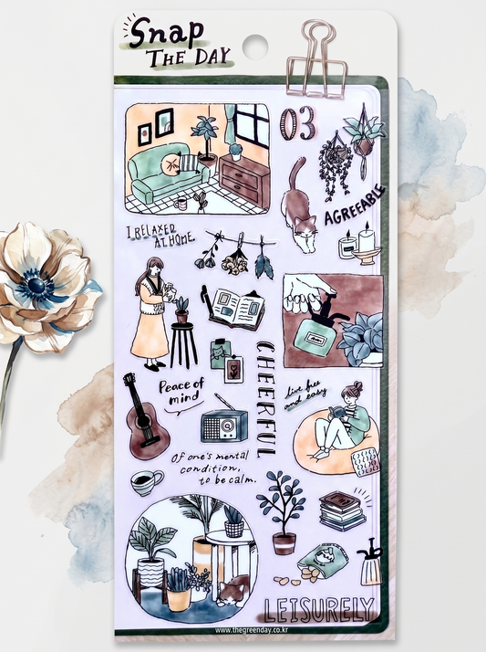 Packaging of 'Snap The Day' stickers with illustrated scenes and text.